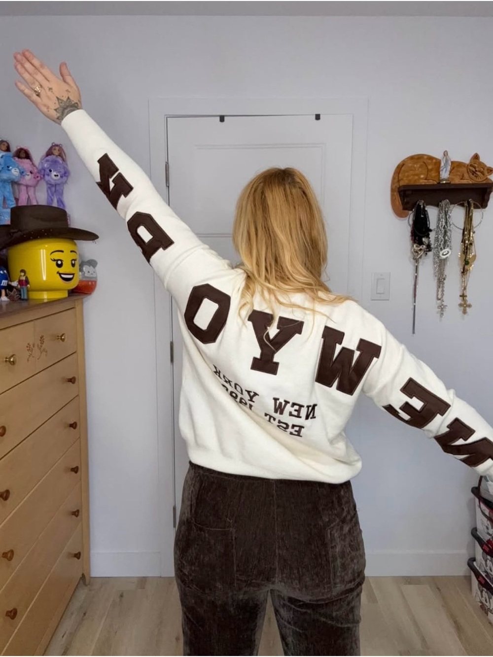 White Sweater with Bold Brown Lettering